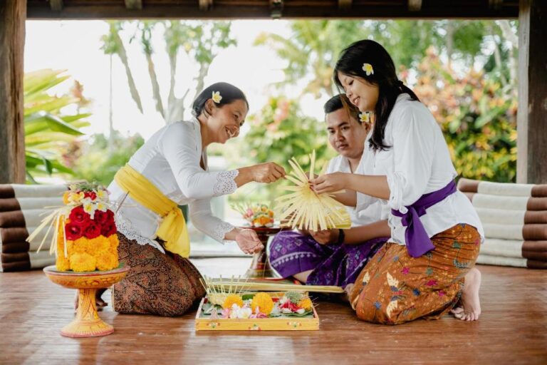Three Balinese women crafting canang, showing How to Make Balinese Offering