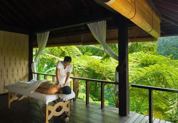 Man relaxing during spa treatment with nature view, part of Bali Wellness Program