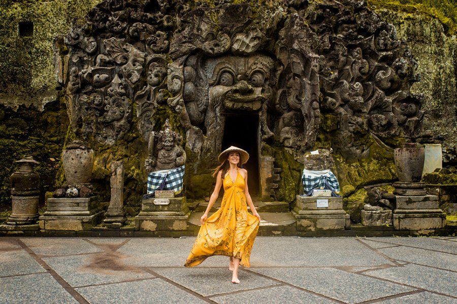 Woman posing at Goa Gajah temple, part of Bali Insta Tour Program
