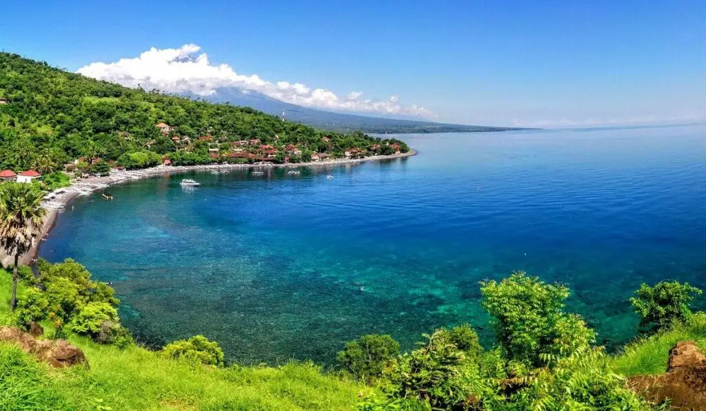Stunning sunrise at Amed Beach, a coastal Hidden Gems in Bali perfect for diving and snorkeling.