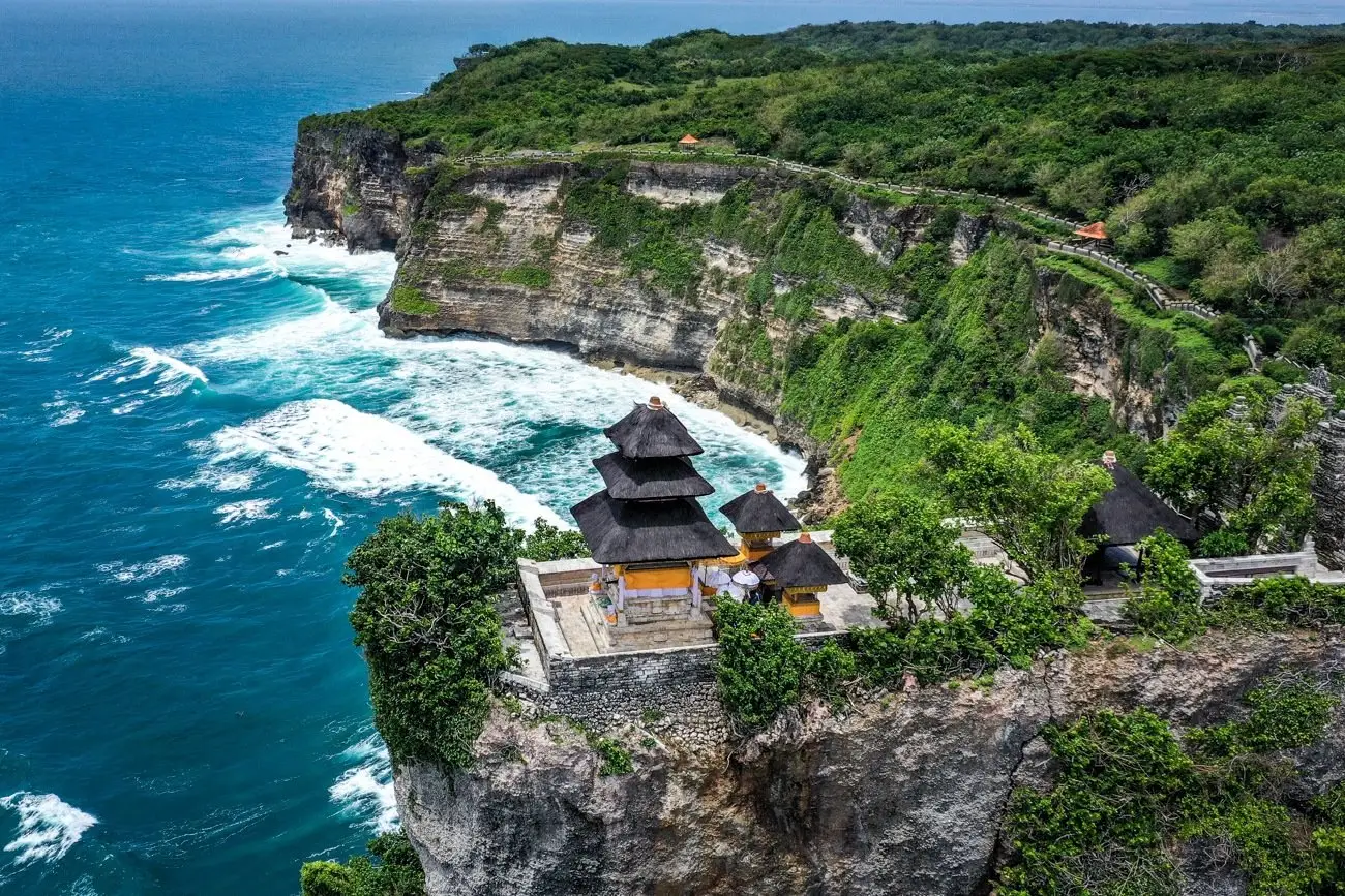 Bali local tour operators leading cultural visit to Uluwatu temple cliff