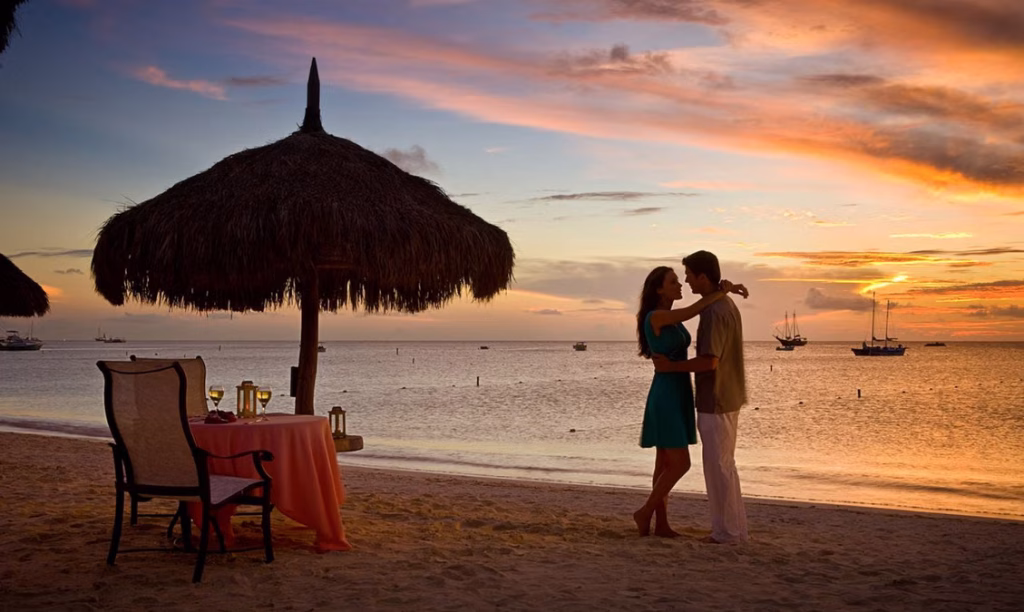 Romantic dinner by the beach during Bali couple tour.