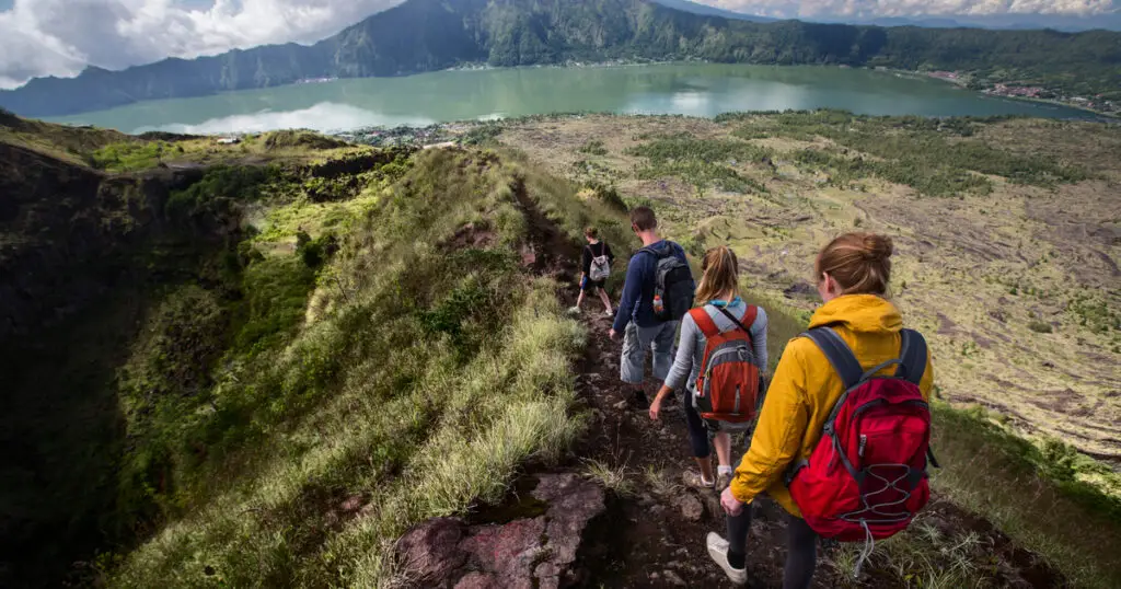 Bali Day Tour trekking Mount Batur to catch the sunrise view.