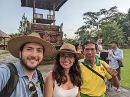 Bali Agung tour guide with travelers exploring authentic Balinese villages