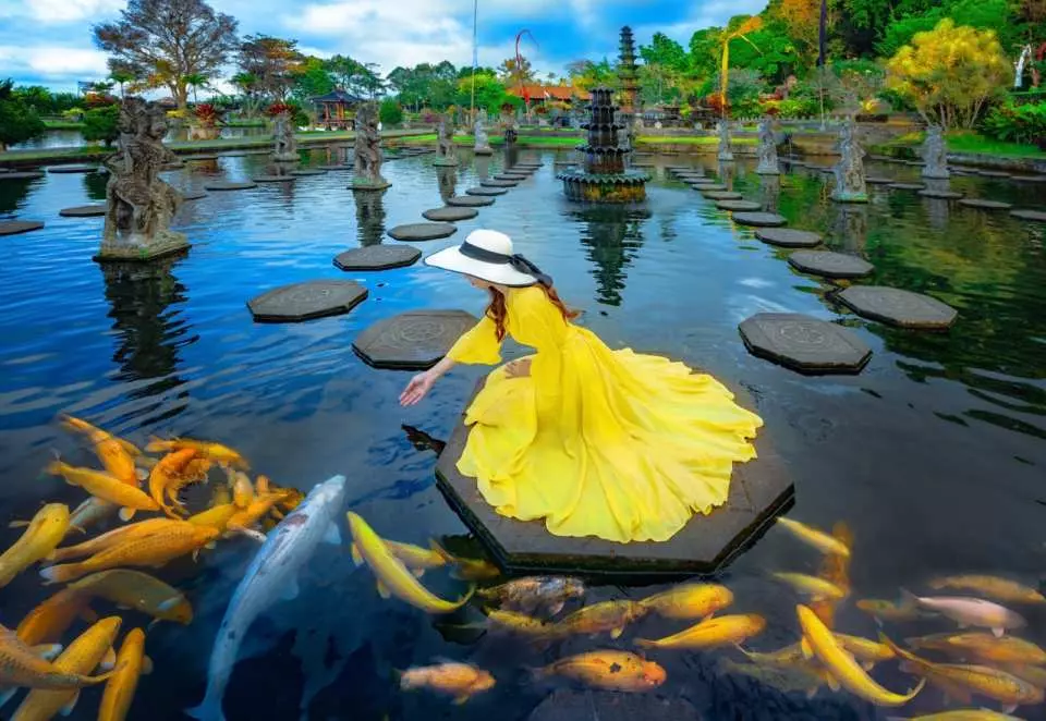Tour Bali Package at Tirta Gangga water palace with koi fish pond