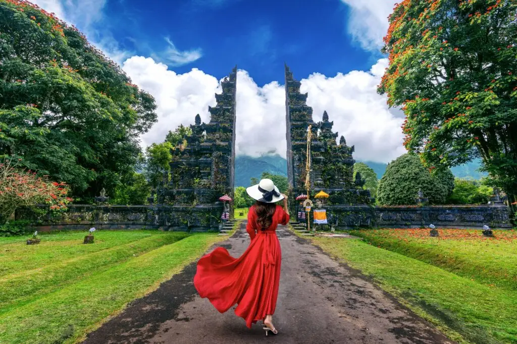 Couple enjoying Bali journey with professional Bali tour guide at iconic landmark