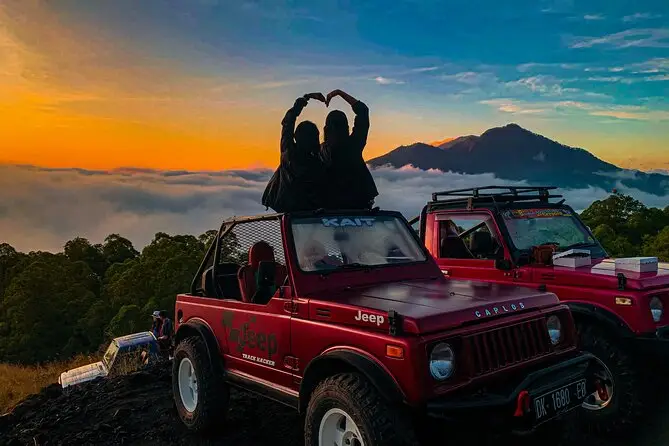 Bali Adventure Tour exploring Mount Batur sunrise by 4x4 jeep through volcanic landscape.