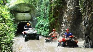 ATV riders exploring jungle tracks during Bali Adventure Tour surrounded by lush nature.