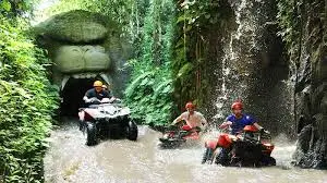 ATV riders exploring jungle tracks during Bali Adventure Tour surrounded by lush nature.