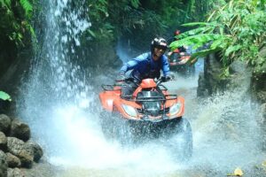 Bali Adventure Tour through muddy jungle tracks on an ATV ride in Ubud.