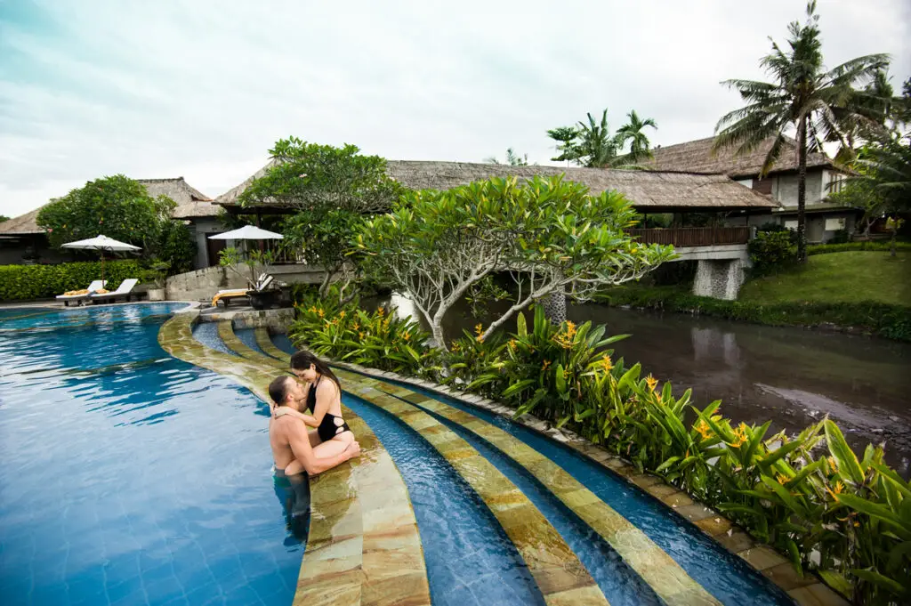 Couple relaxing in a private pool villa in Ubud as part of an affordable Bali honeymoon package.