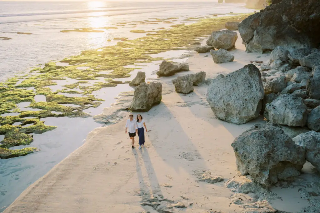 Romantic stroll across Uluwatuโs scenic coastline offered in a customized Bali honeymoon package.